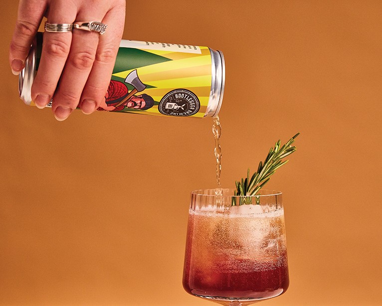 A can of Bootlegger Brewing Kombucha being poured, the beverage brand Jake Haneman built before founding Auroch Canning
